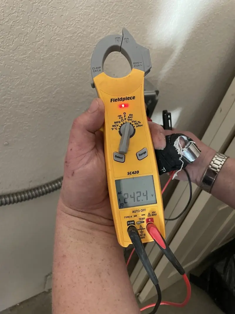 Voltage testing with clamp meter during Generator Installation in Dickinson